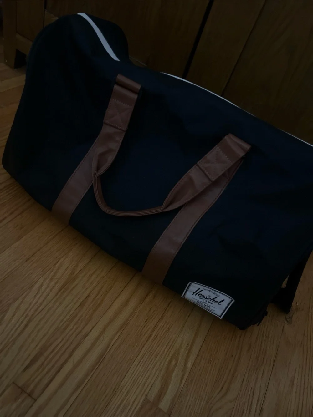 Herschel Supply Company Black Duffel with Brown Handles
